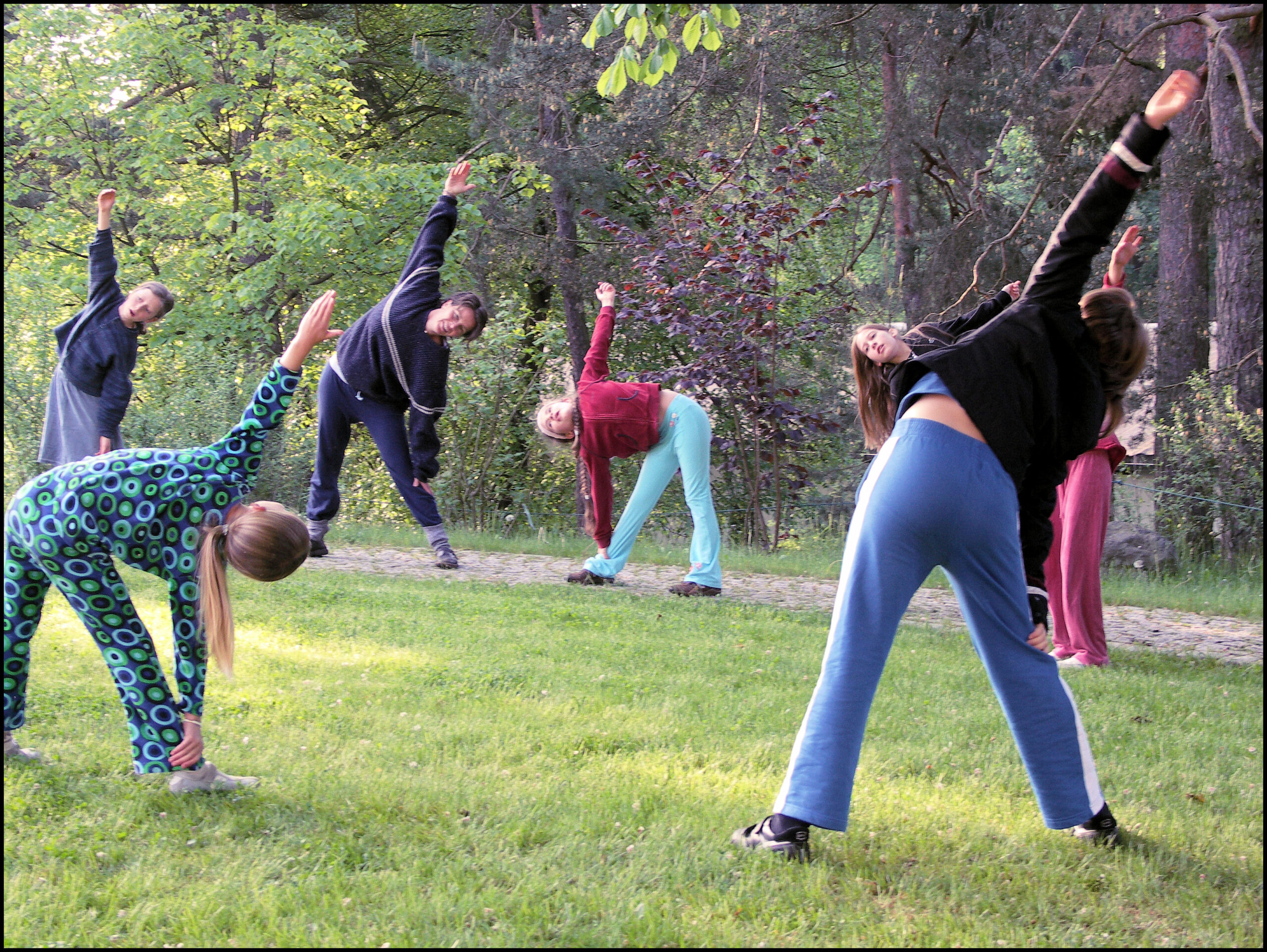 Children and helpers do morning exercise together