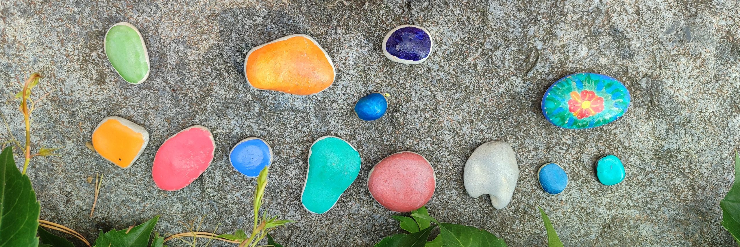 A photo of stones painted by children